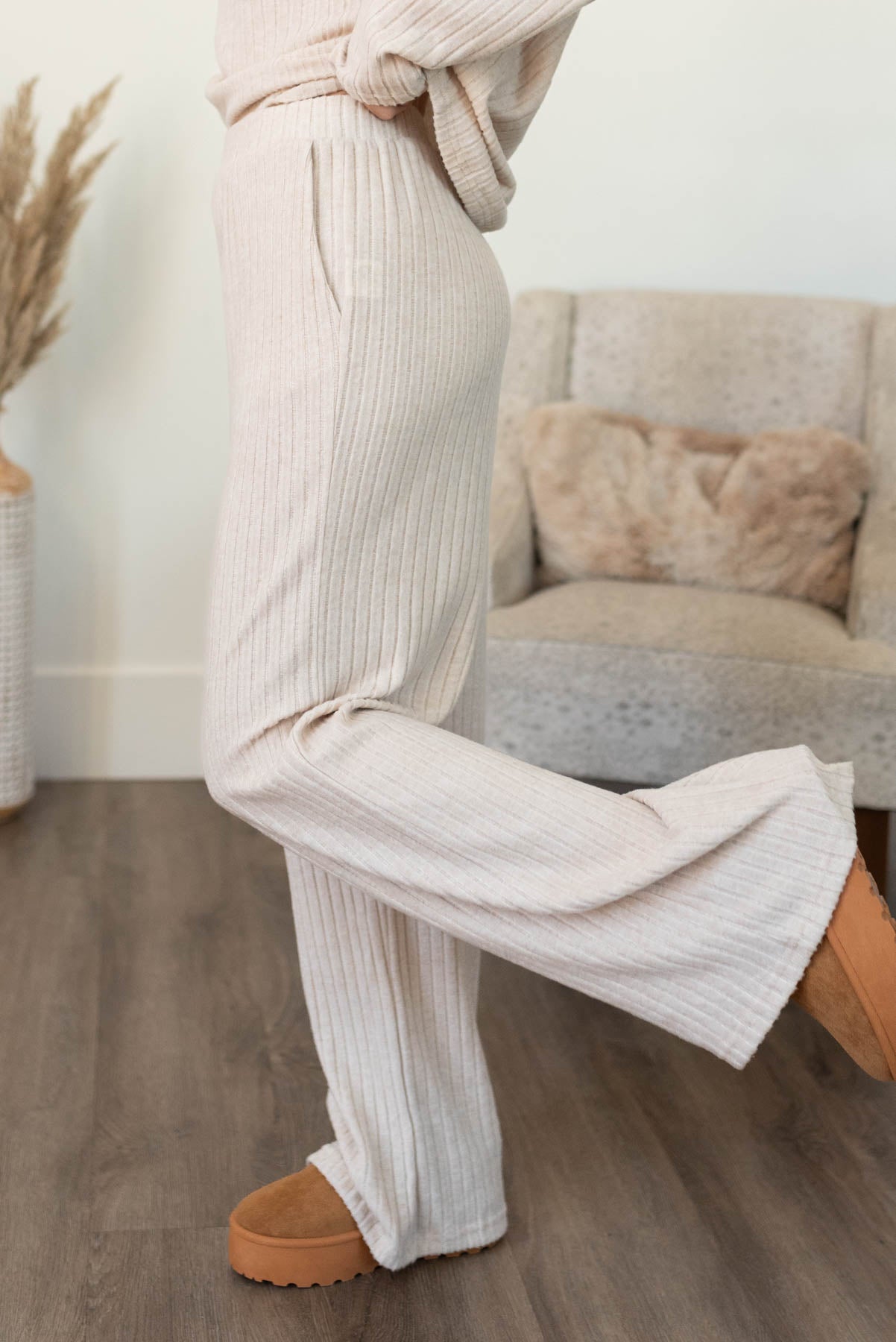 Side view of the pants on the khaki ribbed lounge set with pockets