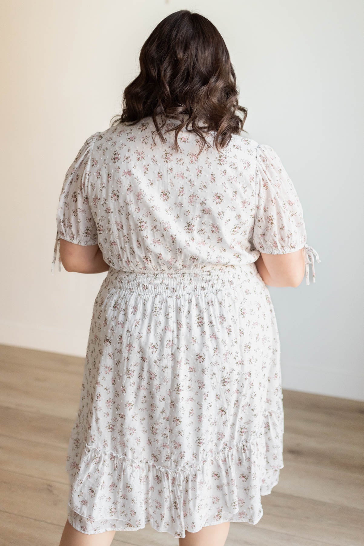 Back view of the plus size ivory swiss dot floral dress