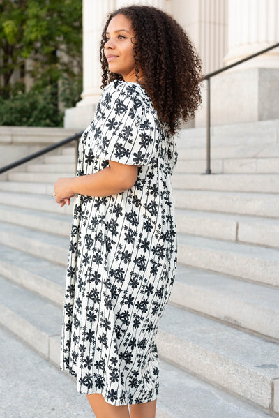 Side view of the cream black floral dress