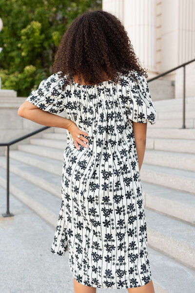 Back view of the cream black floral dress