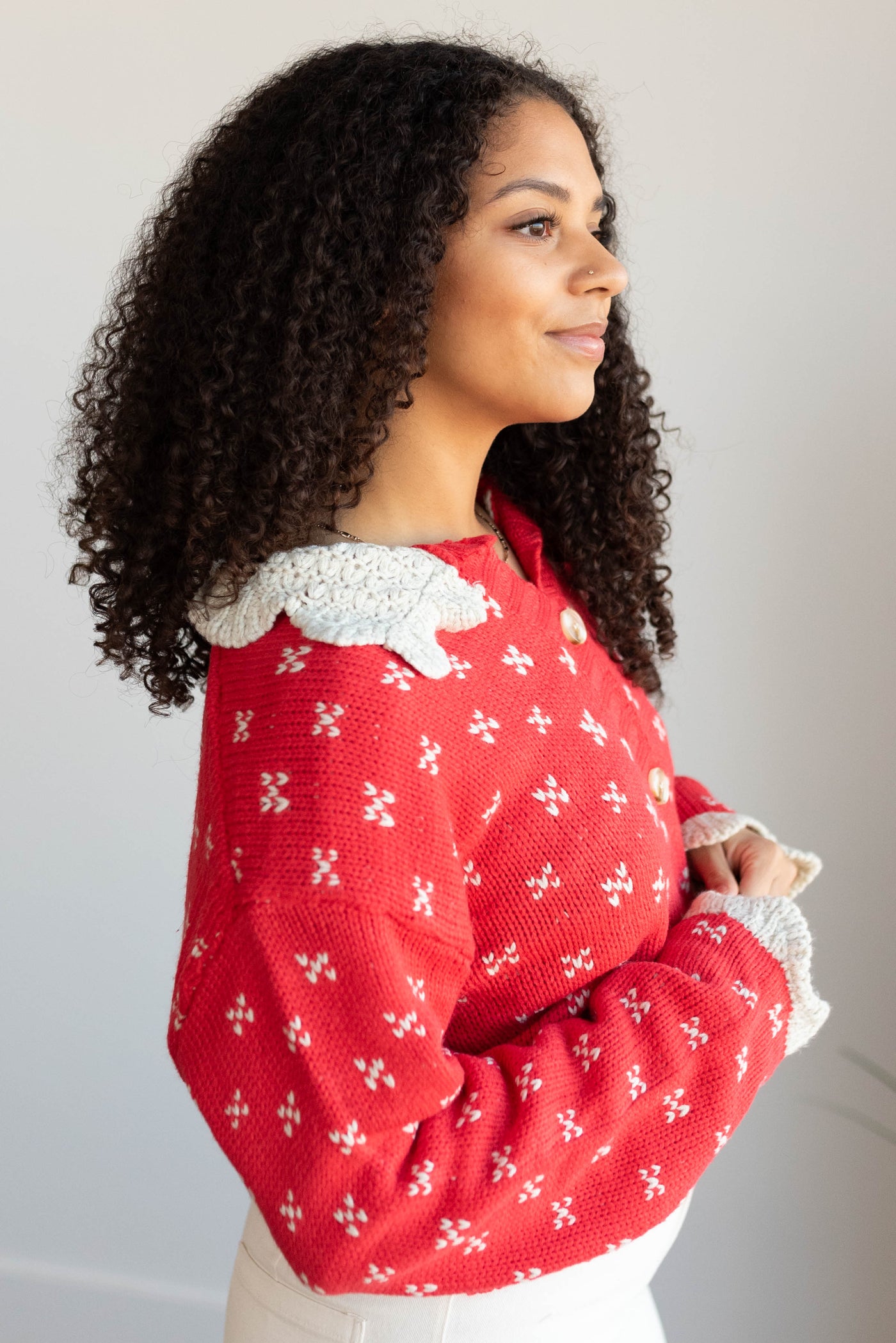 Side view of the red collared sweater top