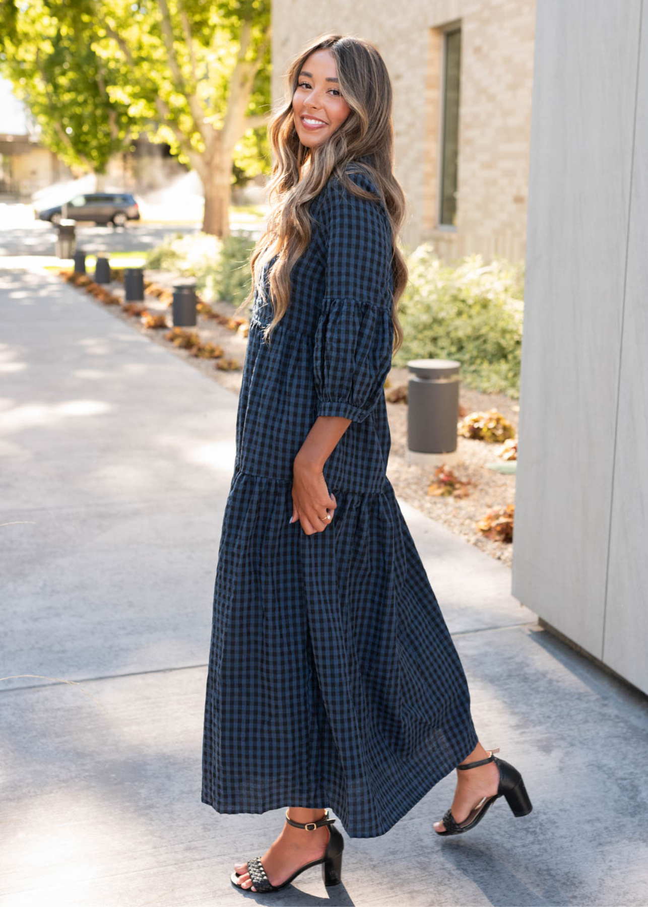 Side view of the navy black gingham dress