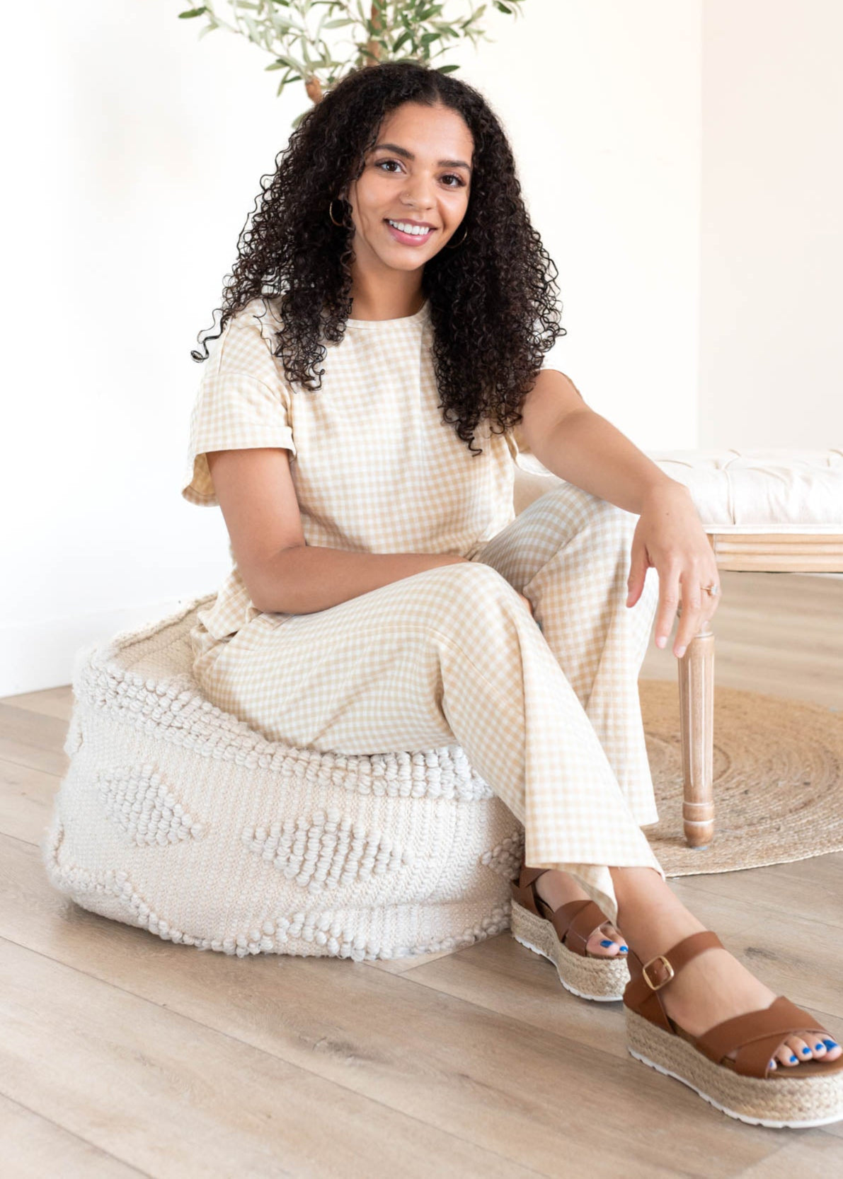 Close up of the gingham print on the beige gingham knit pants