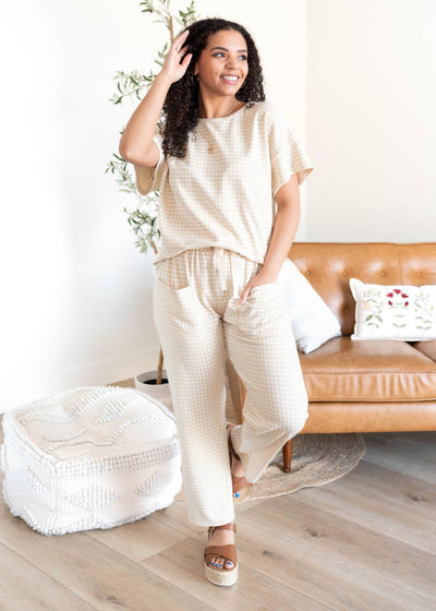 Beige gingham knit pants with front pockets and elastic waist