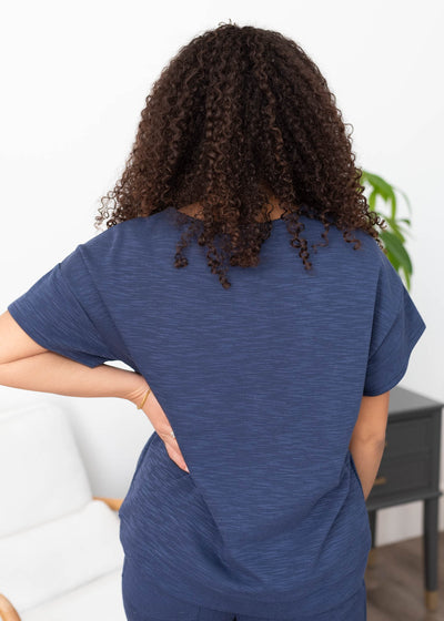 Back view of the navy knit top