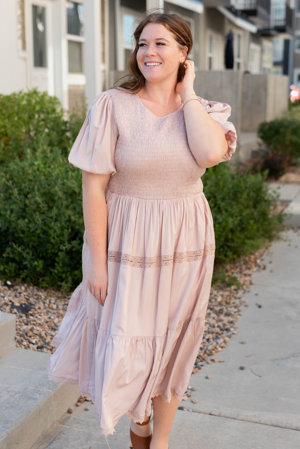 Front view of the blush dress and it's smocked bodice in plus size