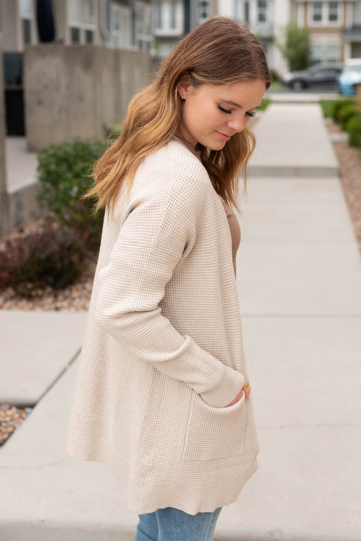 Side view of the oatmeal waffle knit cardigan with long sleeves