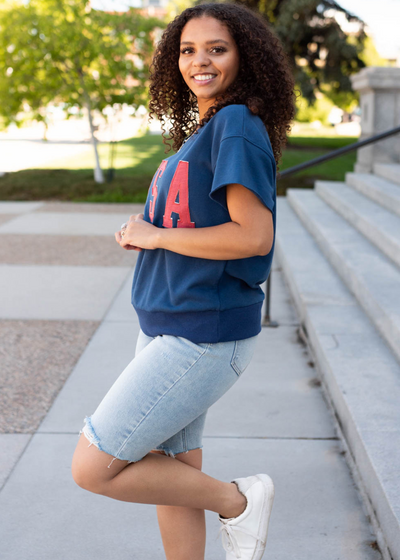 Side view of the navy USA top