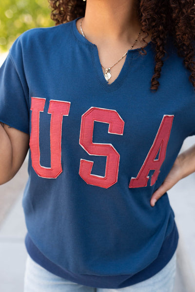 Close up of the USA on the navy USA top