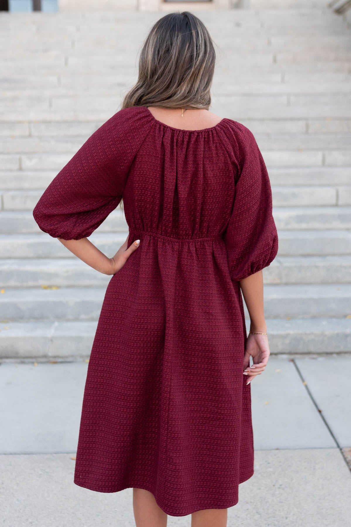 Back view of the burgundy textured dress