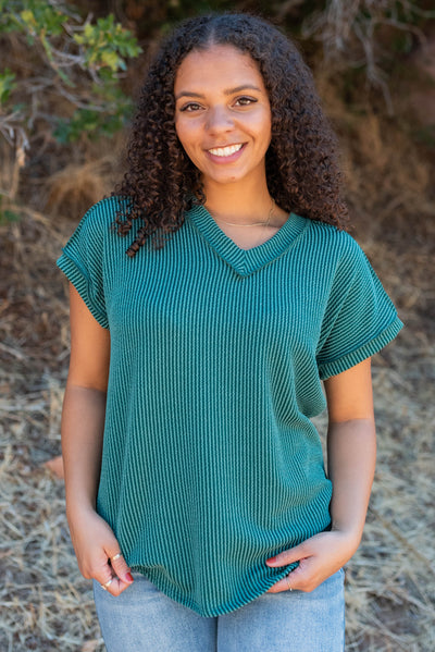 Hunter green ribbed top with a v-neck