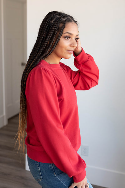 Side view of the red pullover