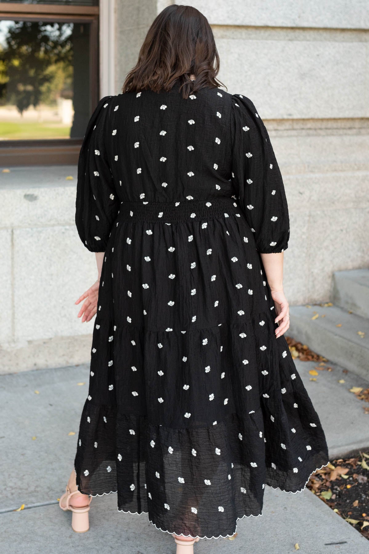 Back view of the black embroidered button dress in plus size