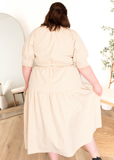 Back view of the plus size taupe gingham dress