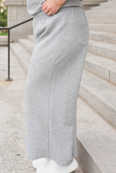 Side view of the heather grey knit pant in plus size