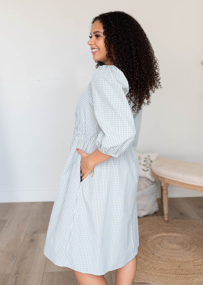 Side view of the plaid tie dress with pockets