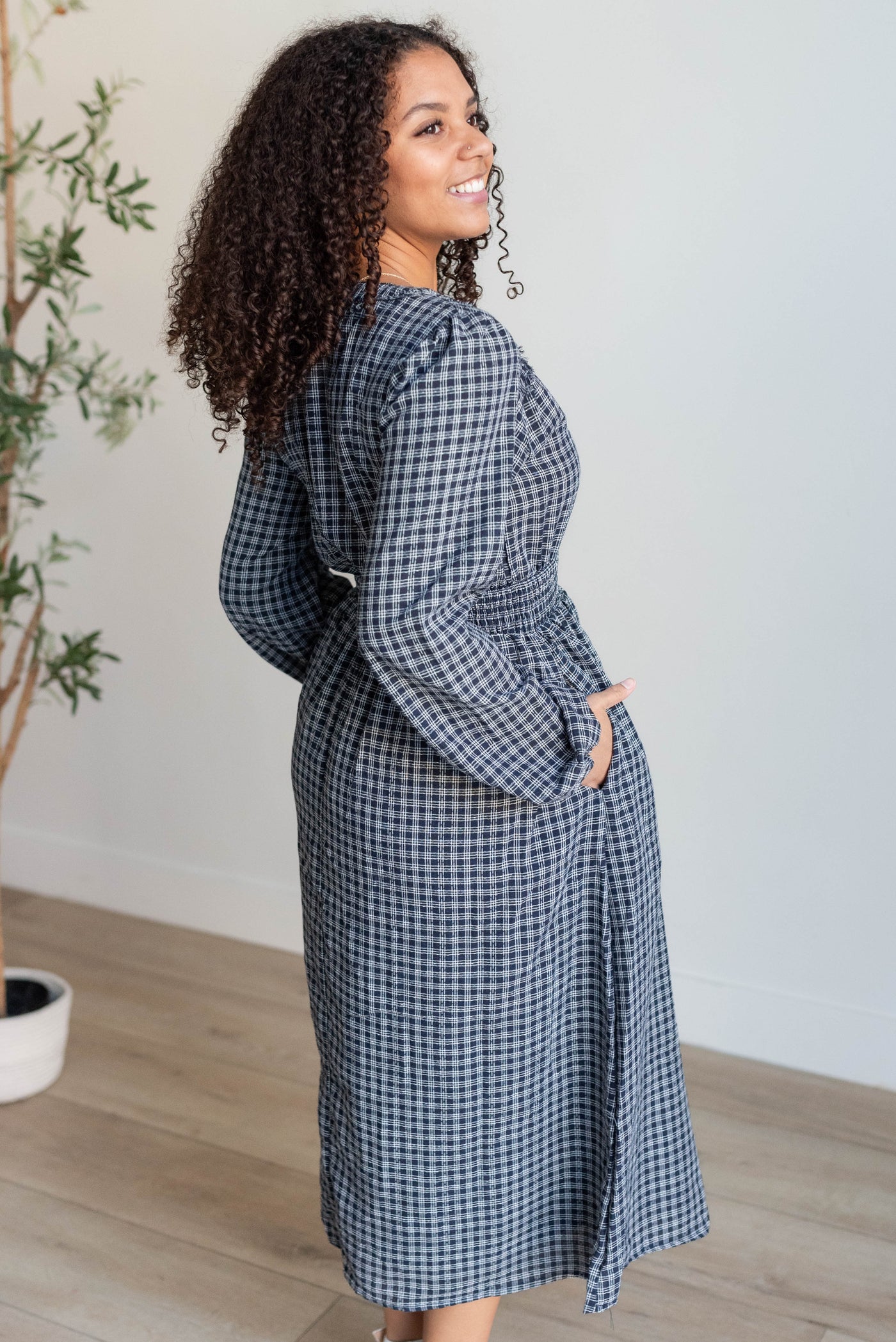 Side view of the navy plaid dress