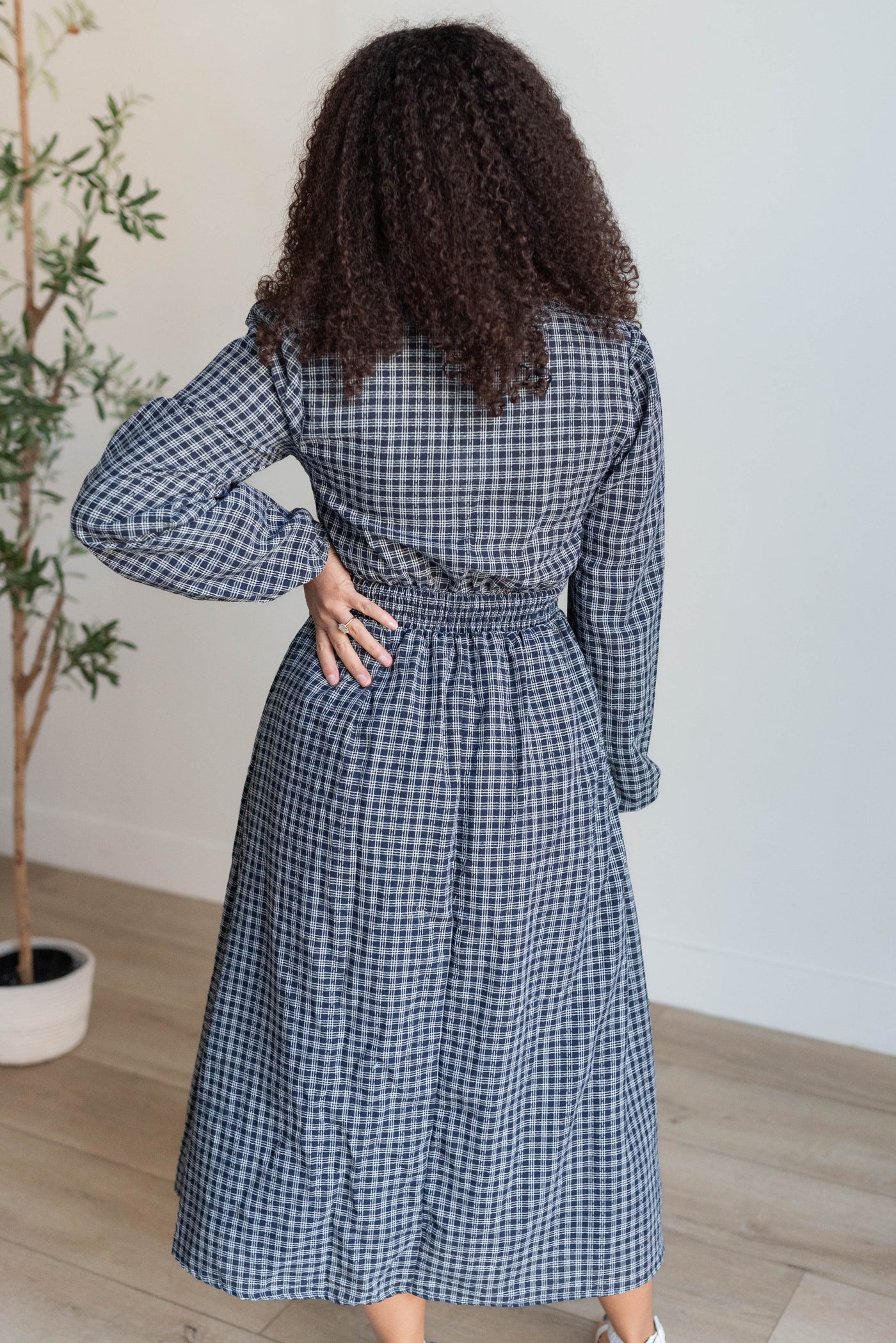 Back view of the navy plaid dress