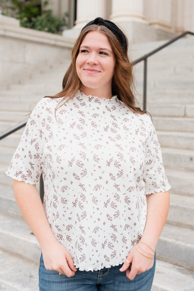 Front view of the ivory floral top