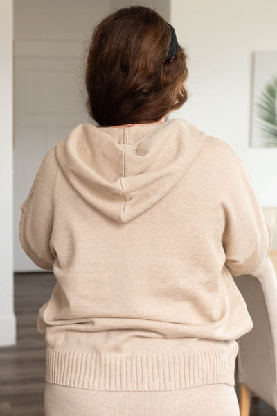 Back view of the taupe sweater with hoodie