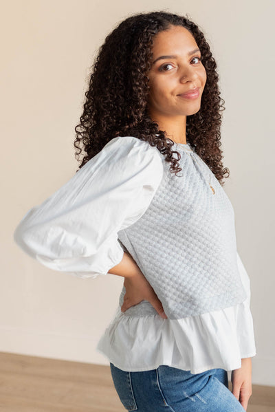 Side view of the heather grey blouse