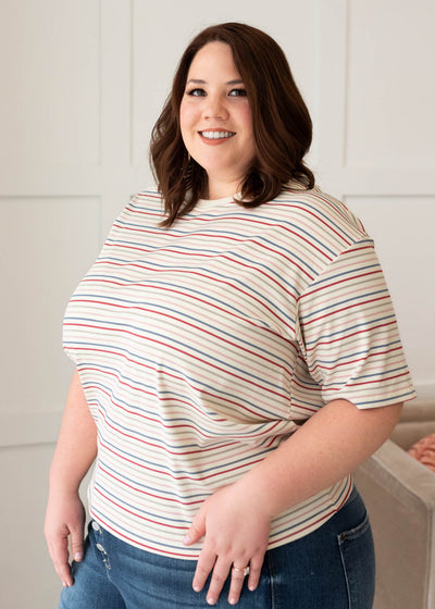 Side view of the ivory multi stripe top in plus size