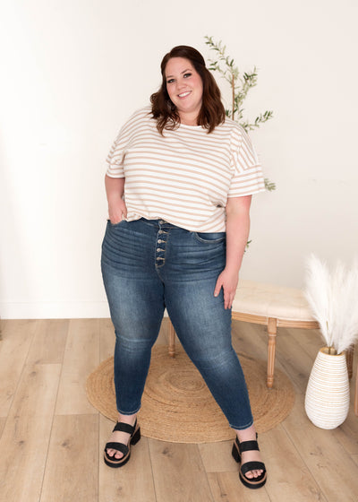 Front view of the plus size taupe stripe top