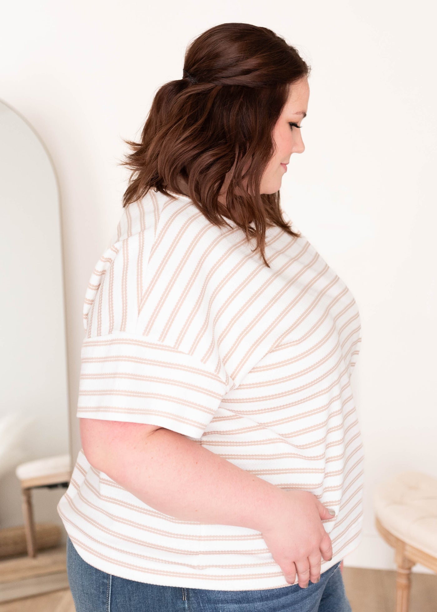 Side view of the taupe stripe top in plus size