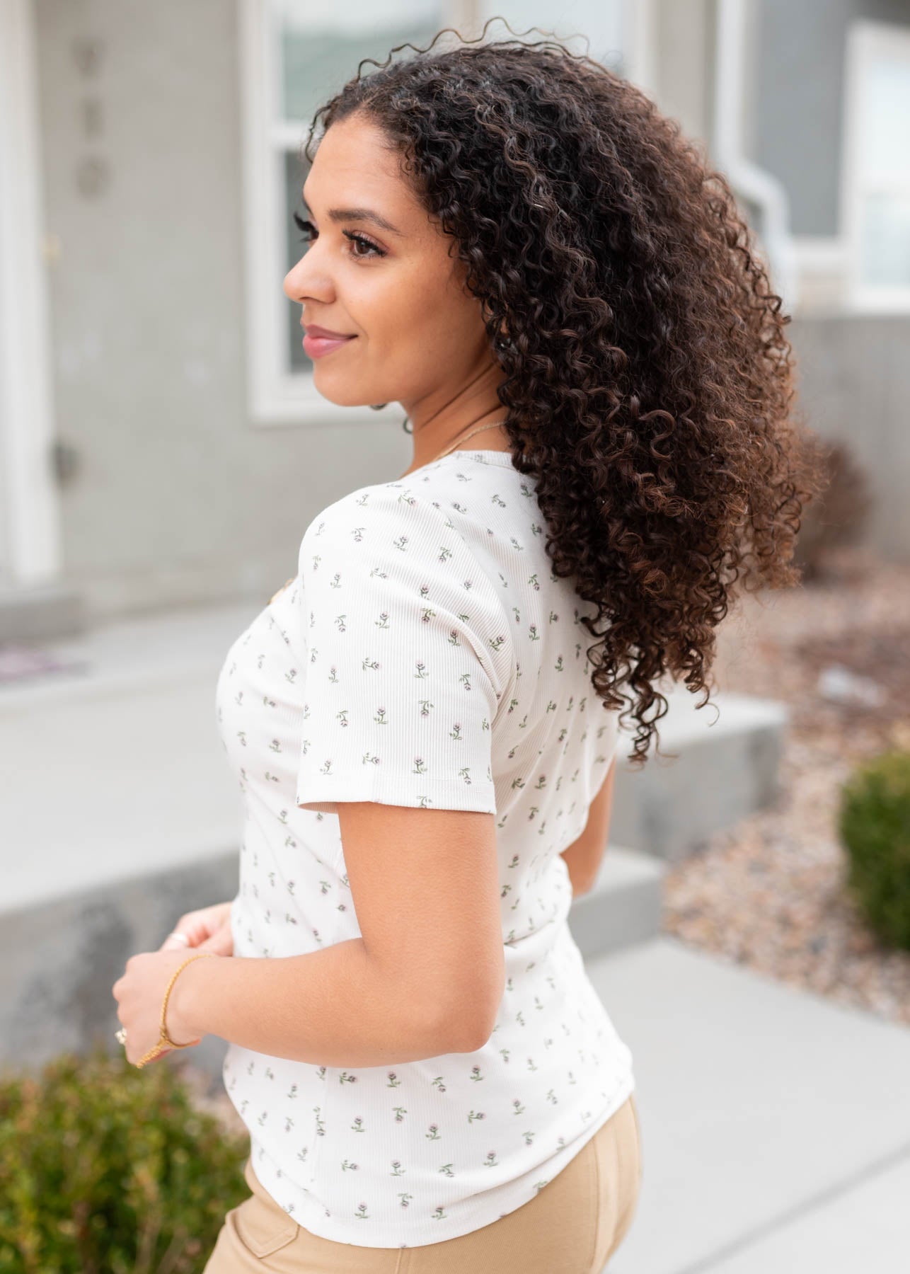 Side view of the ivory sage floral top