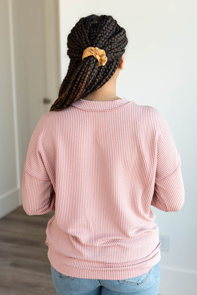 Back view of the light rose ribbed long sleeve top