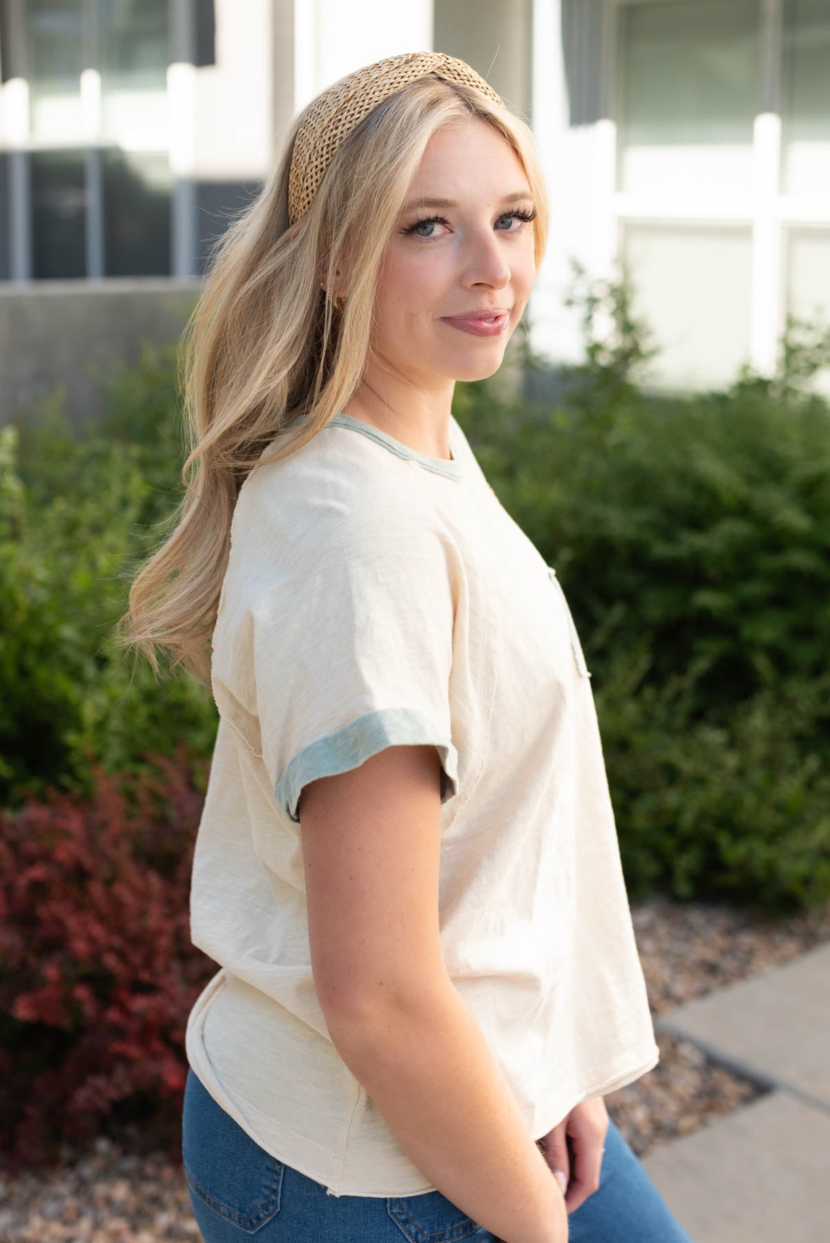 Side view of the cream sage pocket top