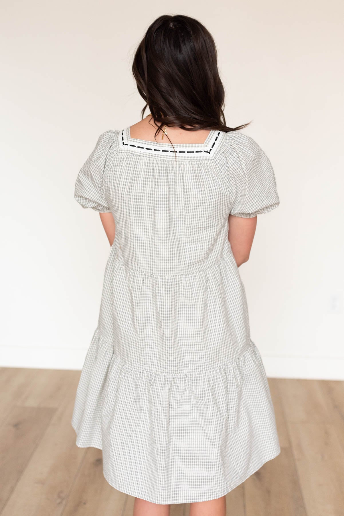 Back view of the black checkered dress