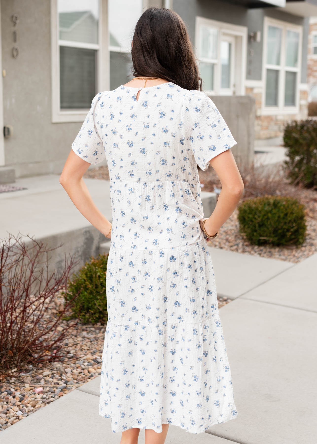 Back view of the blue floral guaze tiered dress