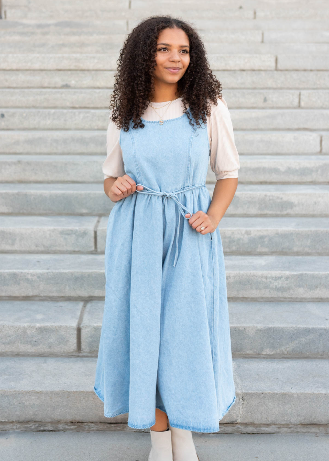 Light denim jumper dress with tie at the waist