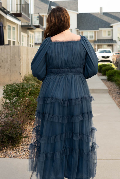 Back view of the plus size navy long sleeve ruffle dress