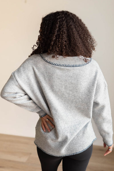 Back view of the navy stitched knit sweater