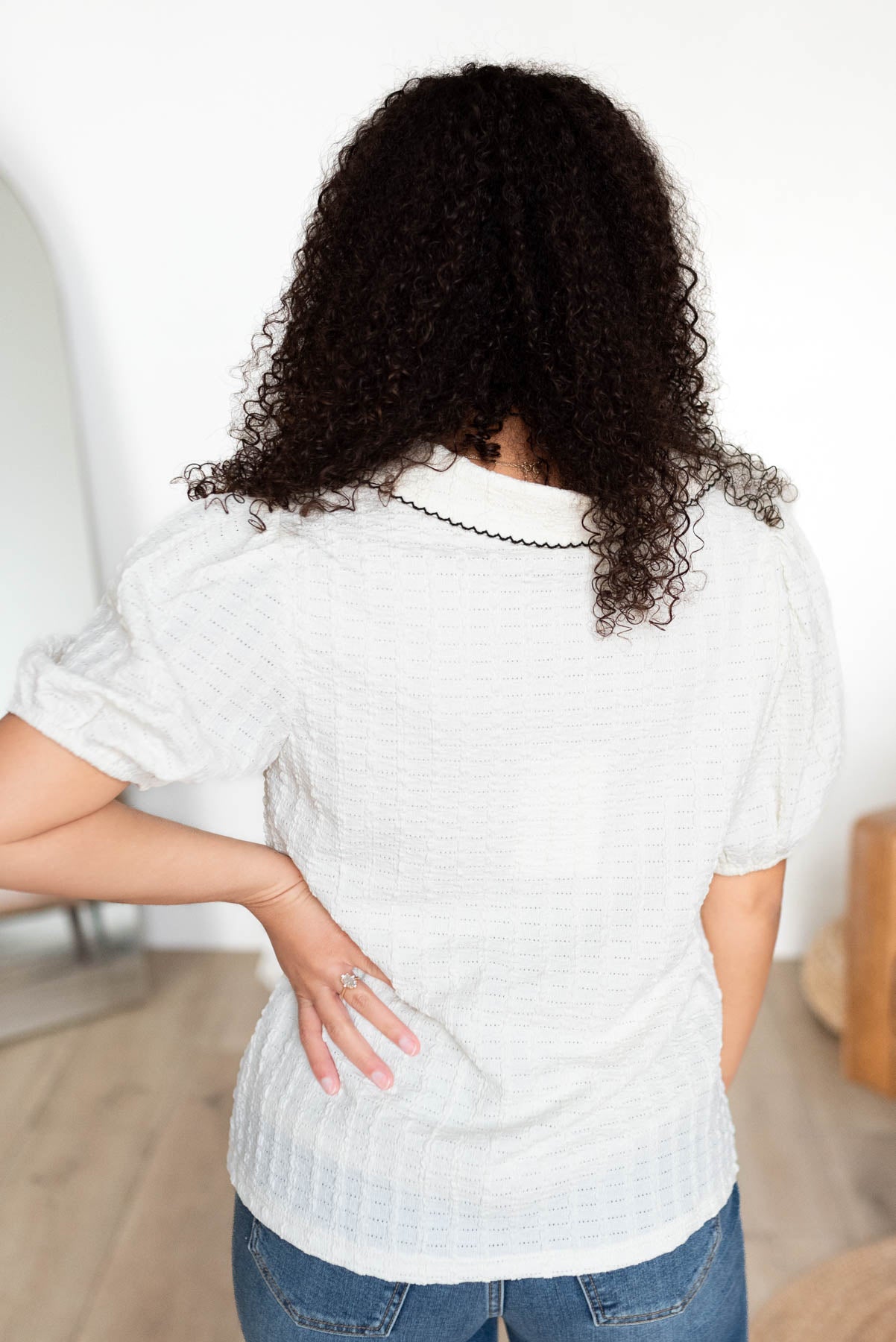 Back view of the cream collared top