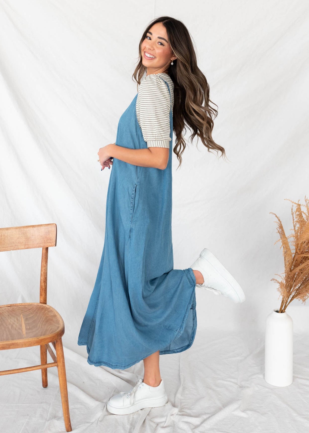 Side view of the sleeveless denim maxi dress