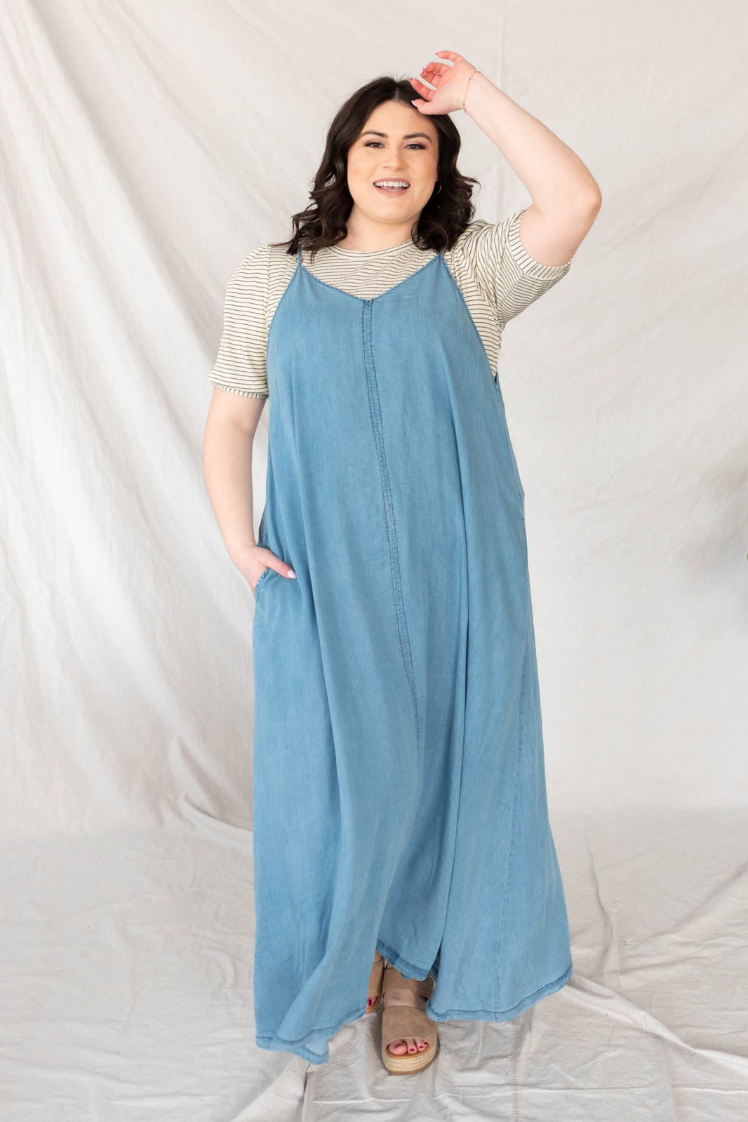 Plus size denim maxi dress with pockets and seam down the front.