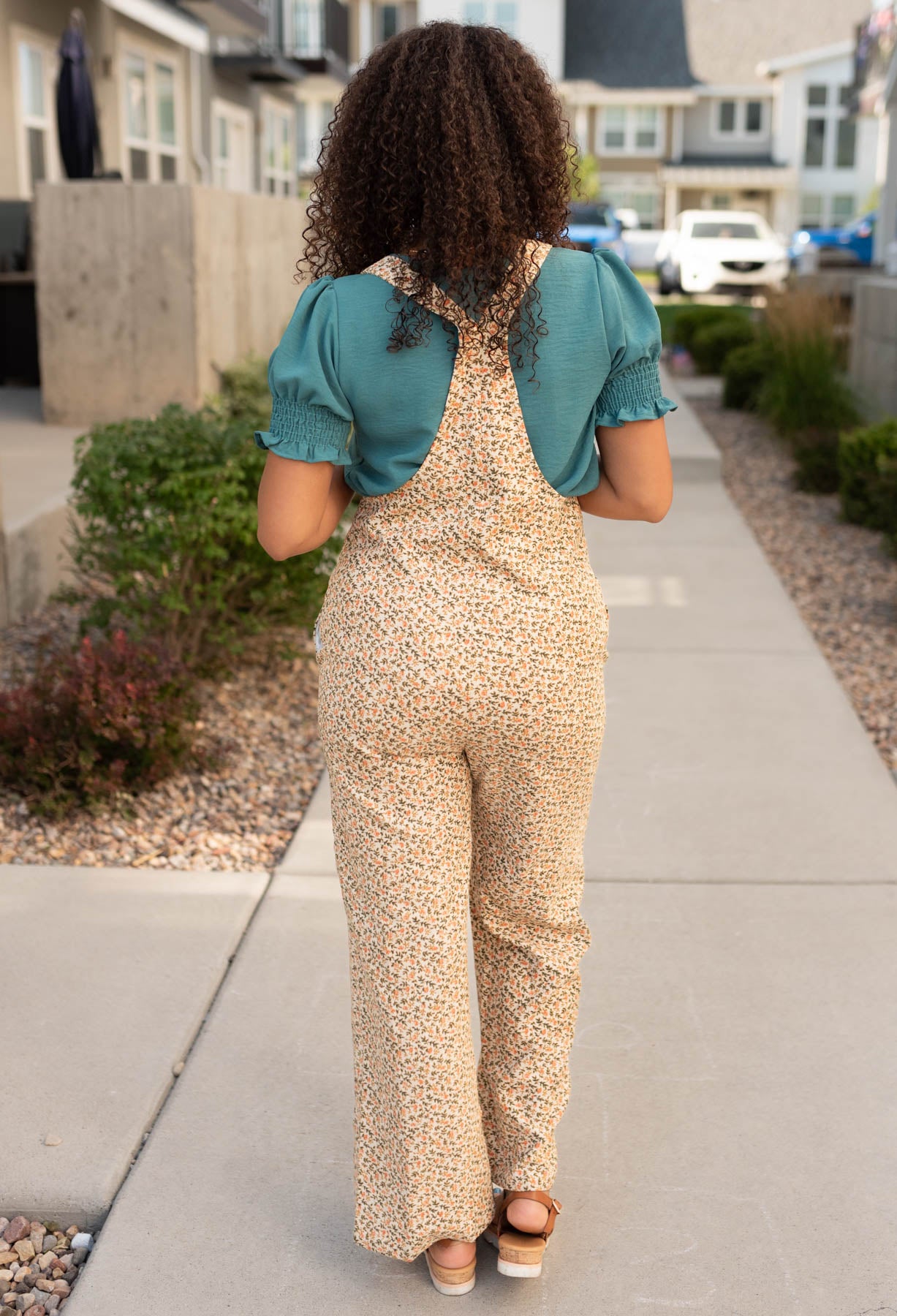 Back view of the cream floral corduroy overalls