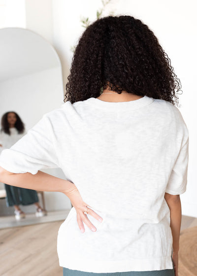 Back view of the white textured top