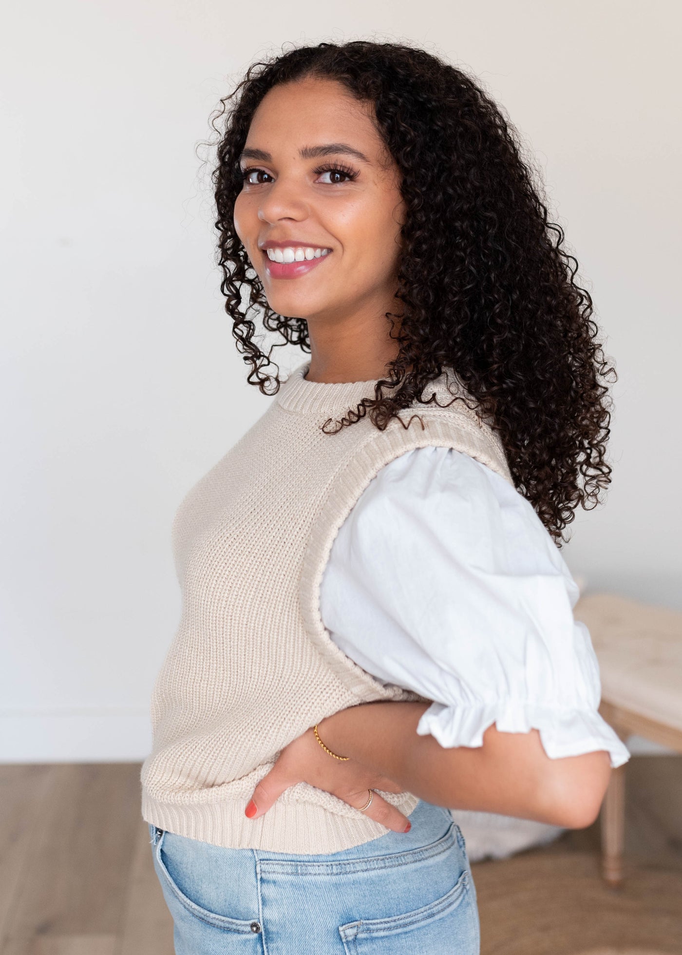 Side view of the natural puff sleeve sweater