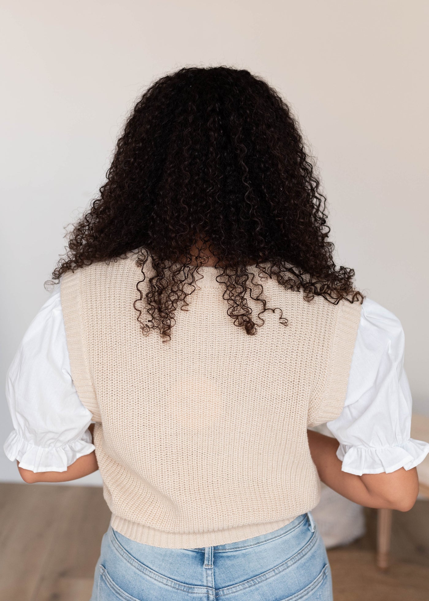 Back view of the natural puff sleeve sweater