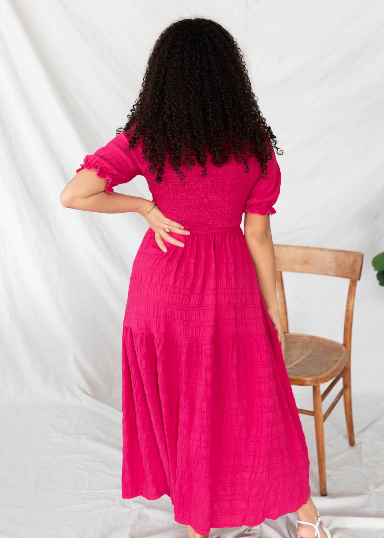 Back view of the hot pink tiered dress