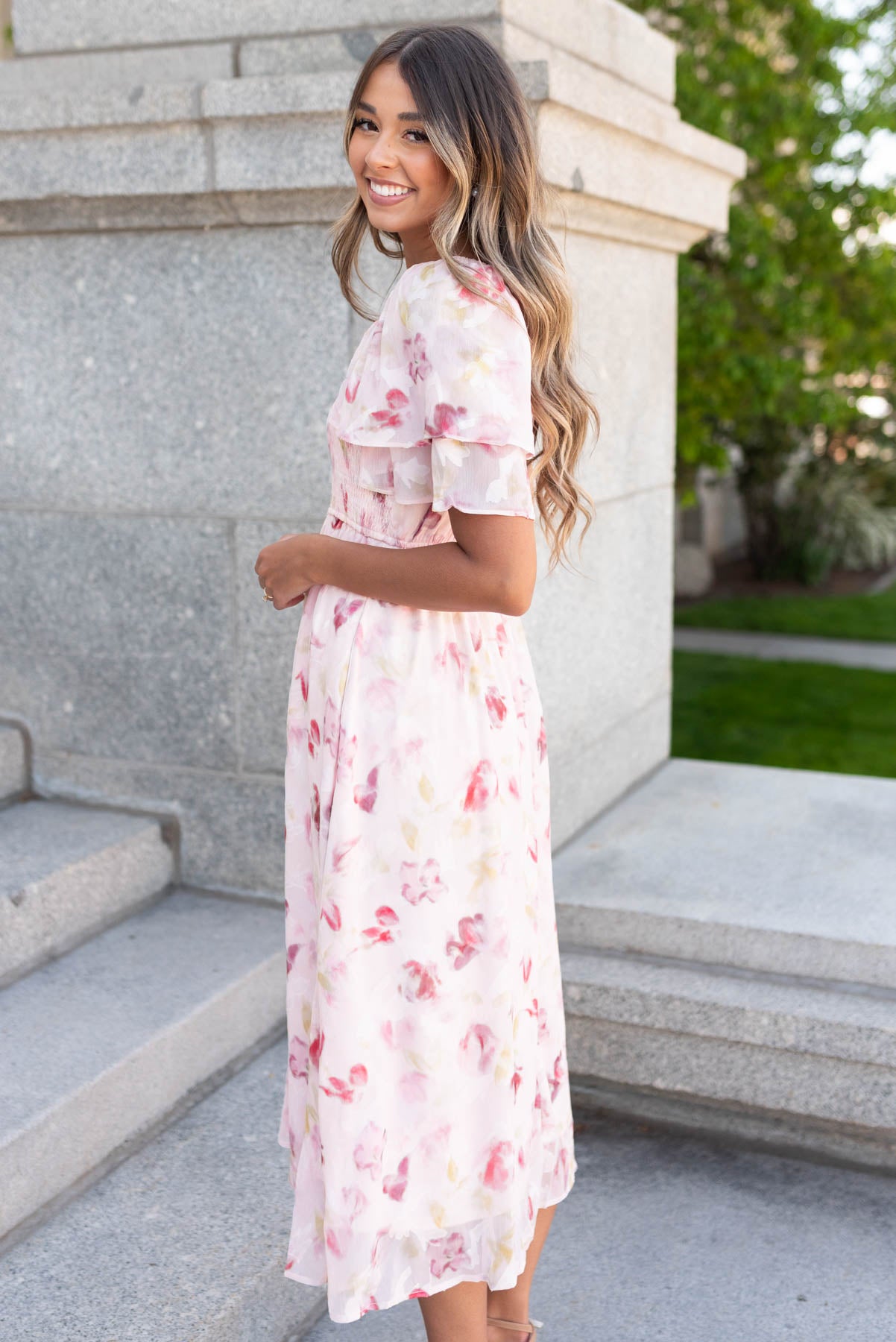 Side view of the blush watercolor floral dress
