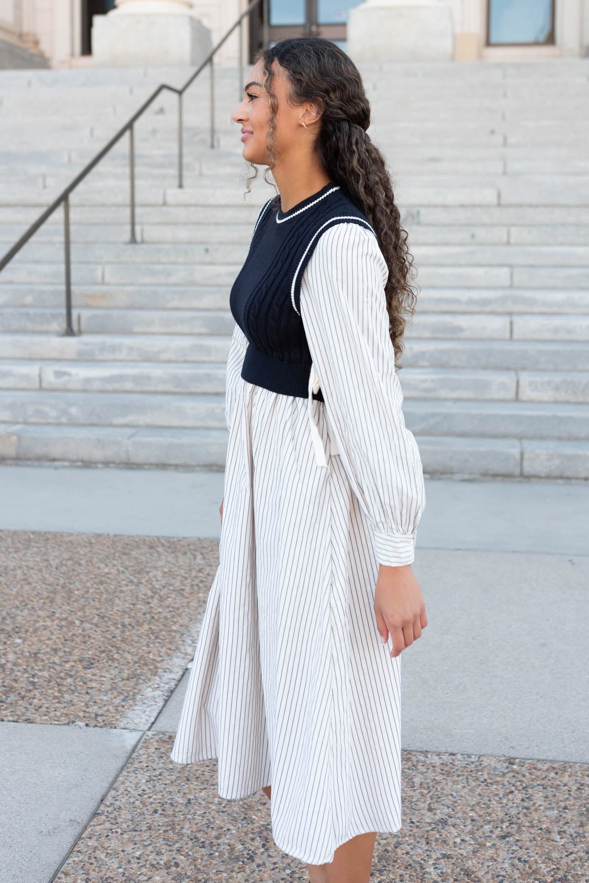 Side view of the navy knit sweater dress