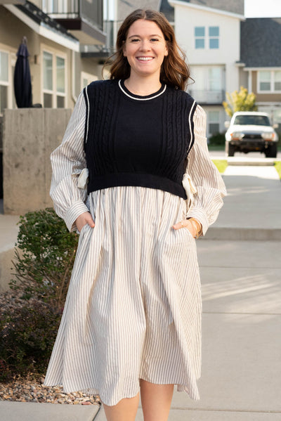 Plus size navy knit sweater dress with pockets