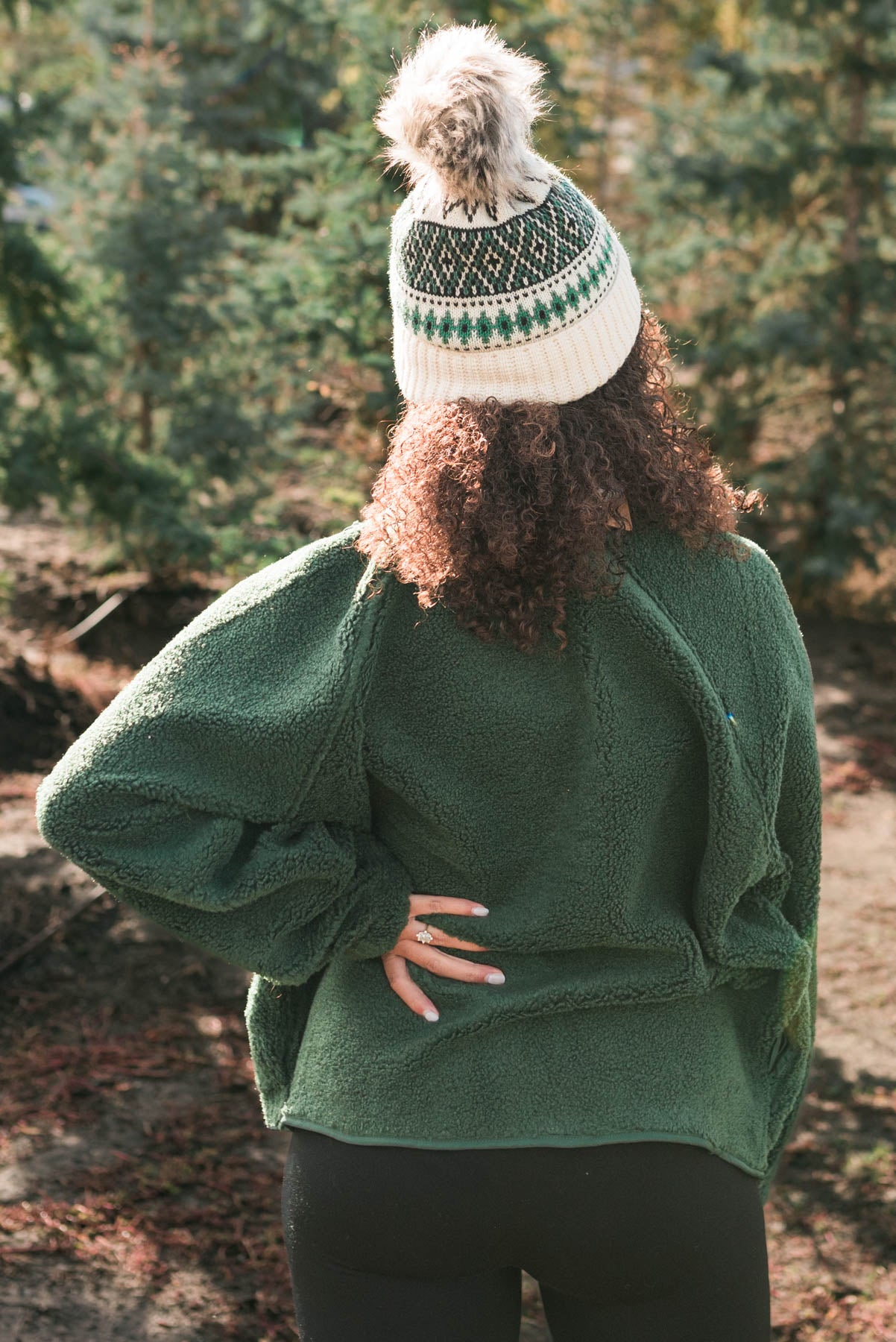 Back view of a hunter green fleece jacket