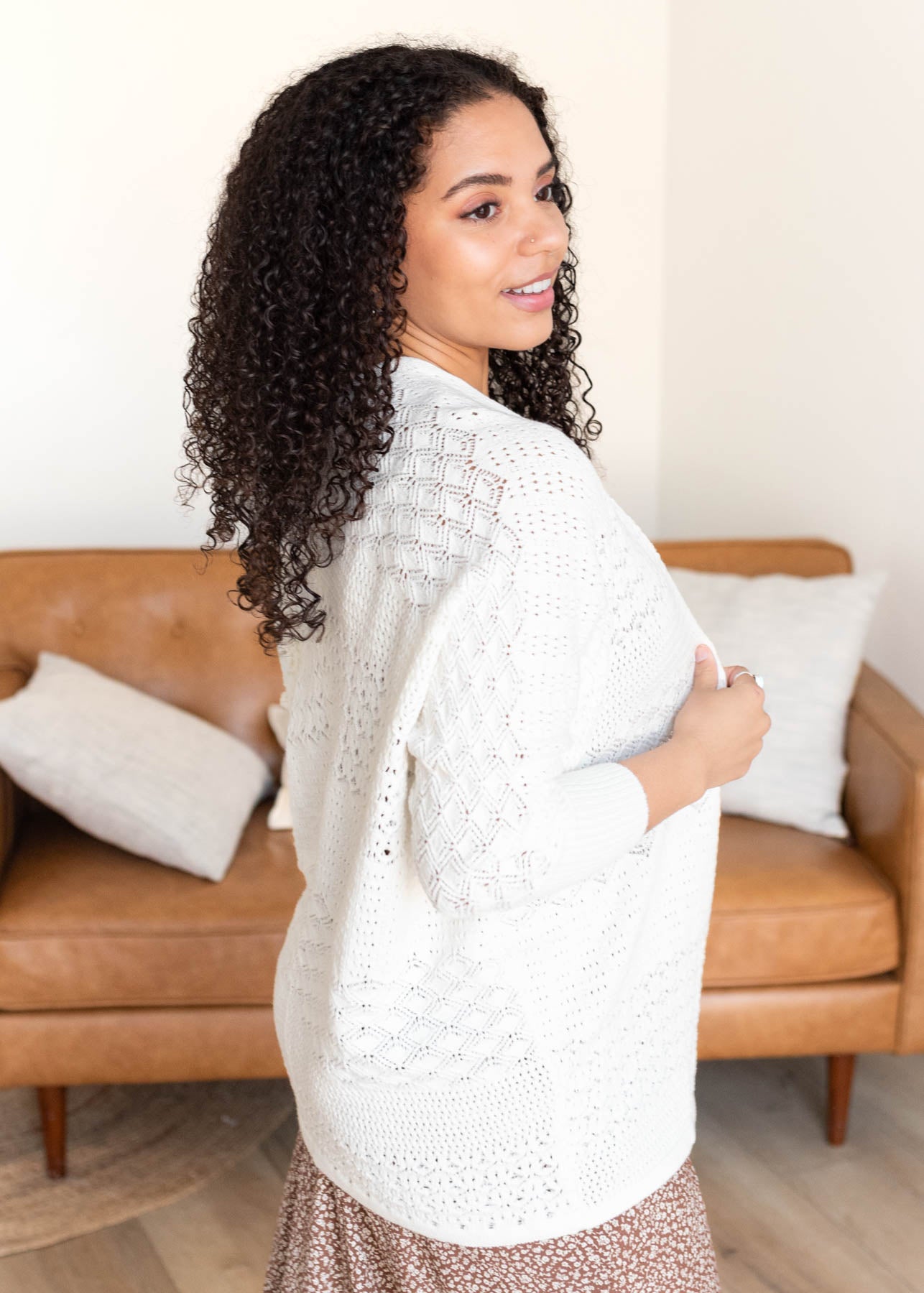 Side view of the ivory crochet knit cardigan