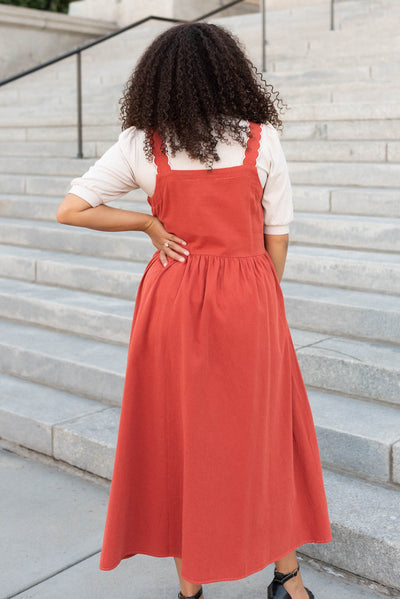 Back view of the burnt orange overall dress